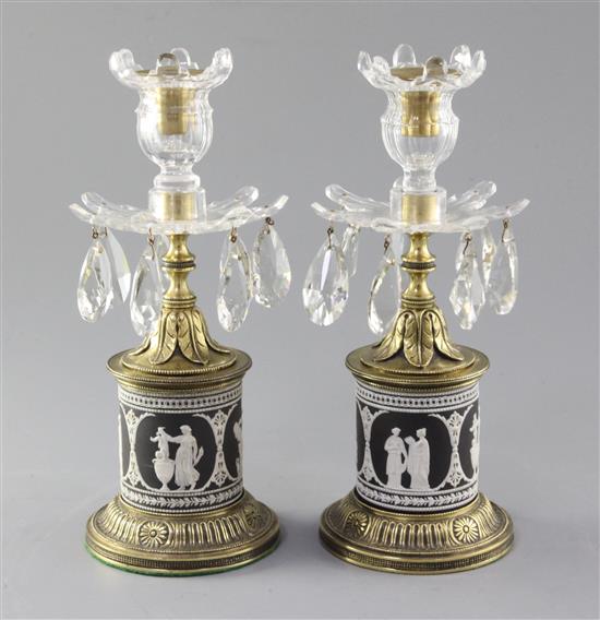 A pair of early 19th century ormolu mounted black jasperware lustre candlesticks, height 10.25in.